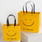 Kantong Kertas Kraft Wajah Senyum Tahan Guncangan ISO Kantong Kertas Bawah Kotak Kuning
